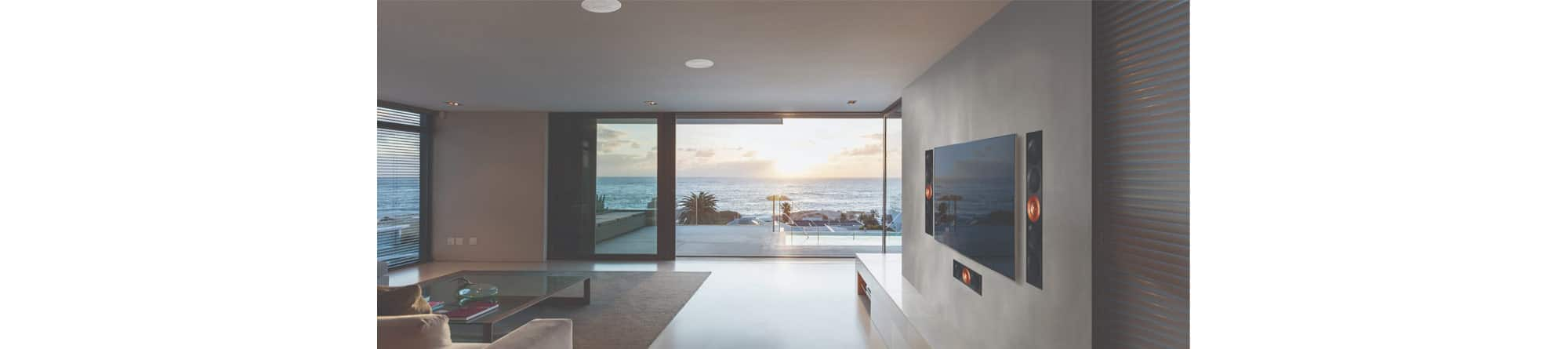 Family room with TV and built-in speakers on the wall