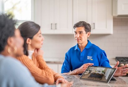 Best Buy employee talking to two people at their consultation