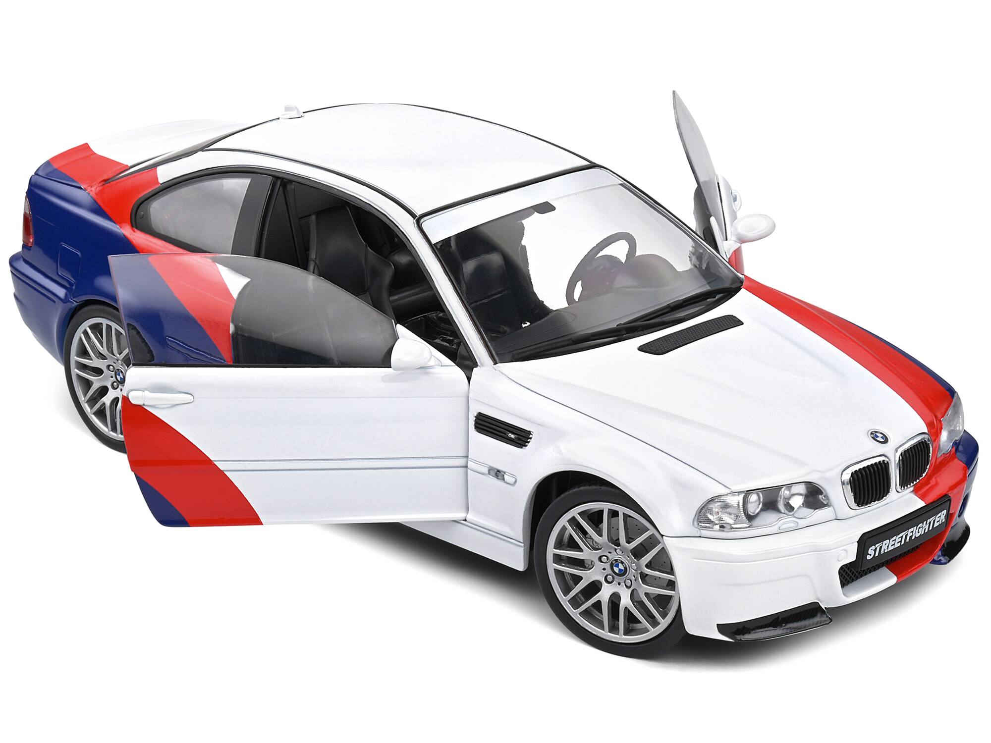 Angle. Solido - 2000 BMW E46 M3 "Streetfighter" White with Blue and Red Graphics 1/18 Diecast Model Car by Solido - White With Blue And Red.