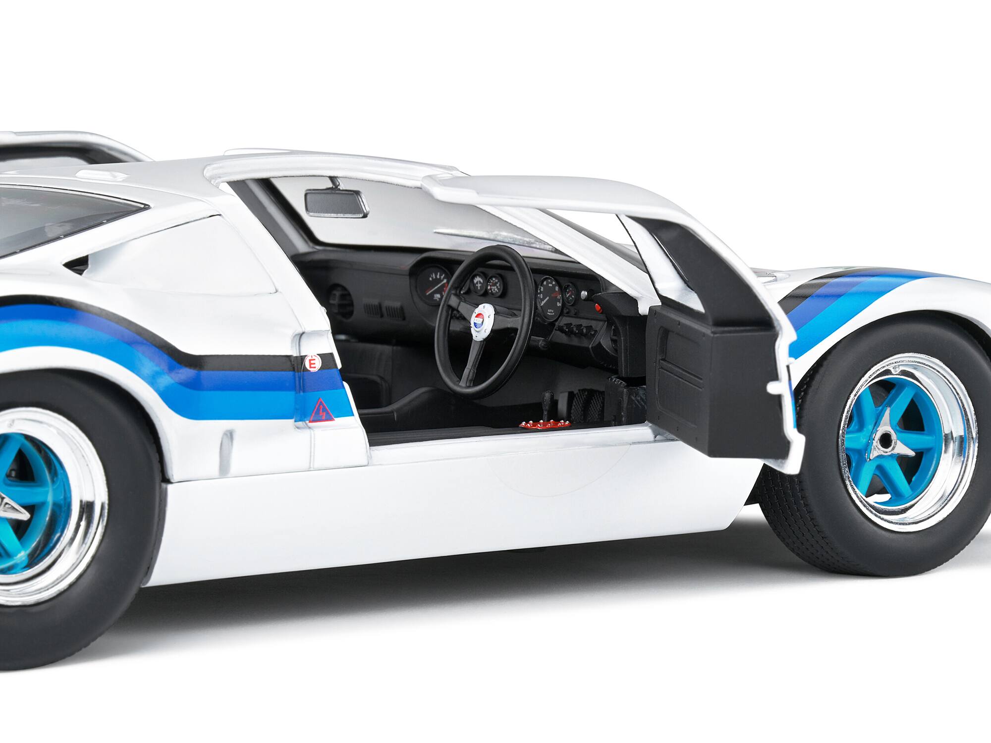 Left. Solido - Ford GT40 MK.1 RHD (Right Hand Drive) #19 Emilio Marta "Angola Championship" (1973) "Competition" Series 1/18 - White And Blue.