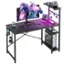 The image features a computer desk with a monitor, keyboard, and mouse on it. There is also a laptop on the desk, along with a cell phone. The desk is set up in a workspace, and there are two cans of soda nearby. Additionally, there is a cup on the desk, and a TV is mounted on the wall above the desk.