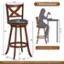 The image features a wooden bar stool with a woman's silhouette on it. The stool has a height of 40-43 inches, and the dimensions are 16.5 inches in diameter. The stool is compatible with a bar height of 40-43 inches. The image also includes a note about color differences that may occur due to different lighting and monitors.