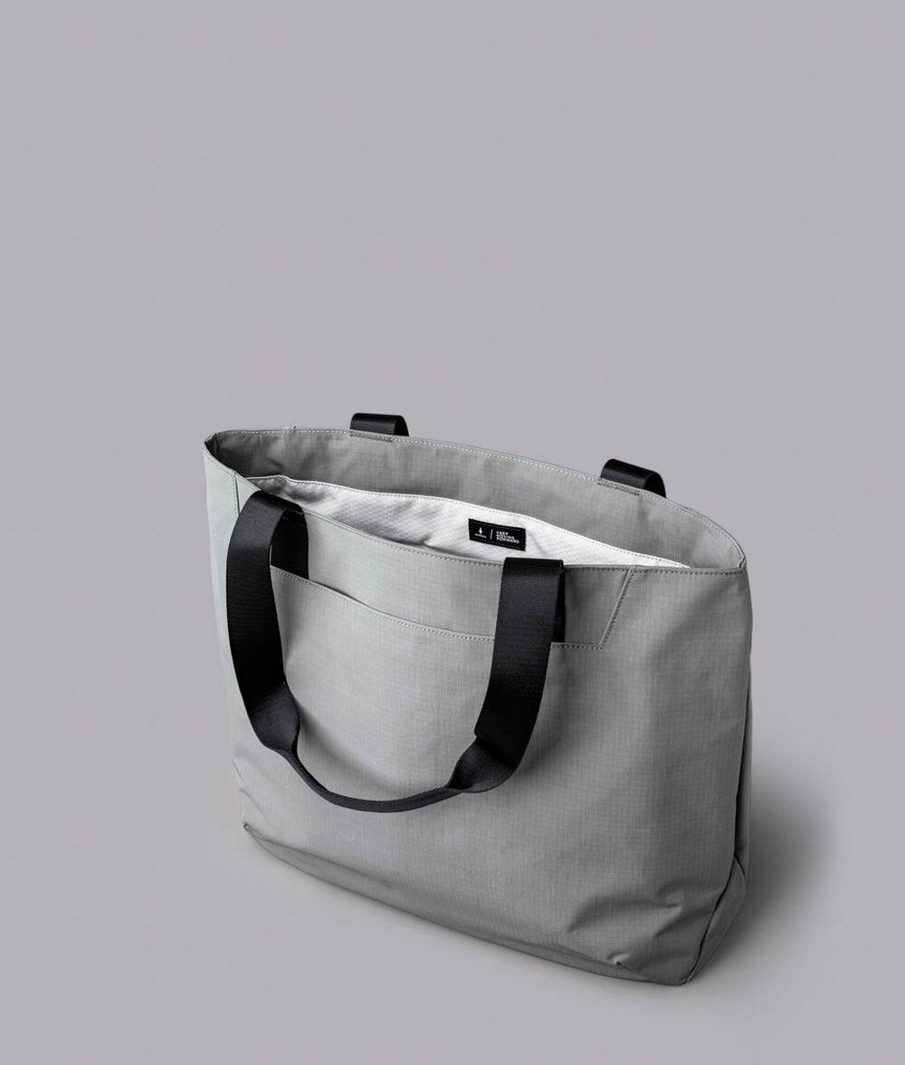 Alt View 2. ALPAKA - Elements Tote 20L Laptop Tote Bag with Padded 16" Sleeve,Open Top with Magnetic Closure - Grey Axoflux 210D.