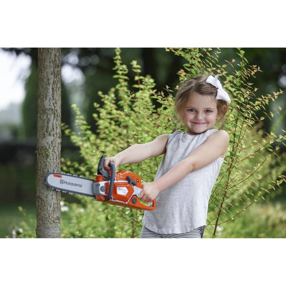 Left. Husqvarna - 550XP Toy Chainsaw with (3) AA Batteries.