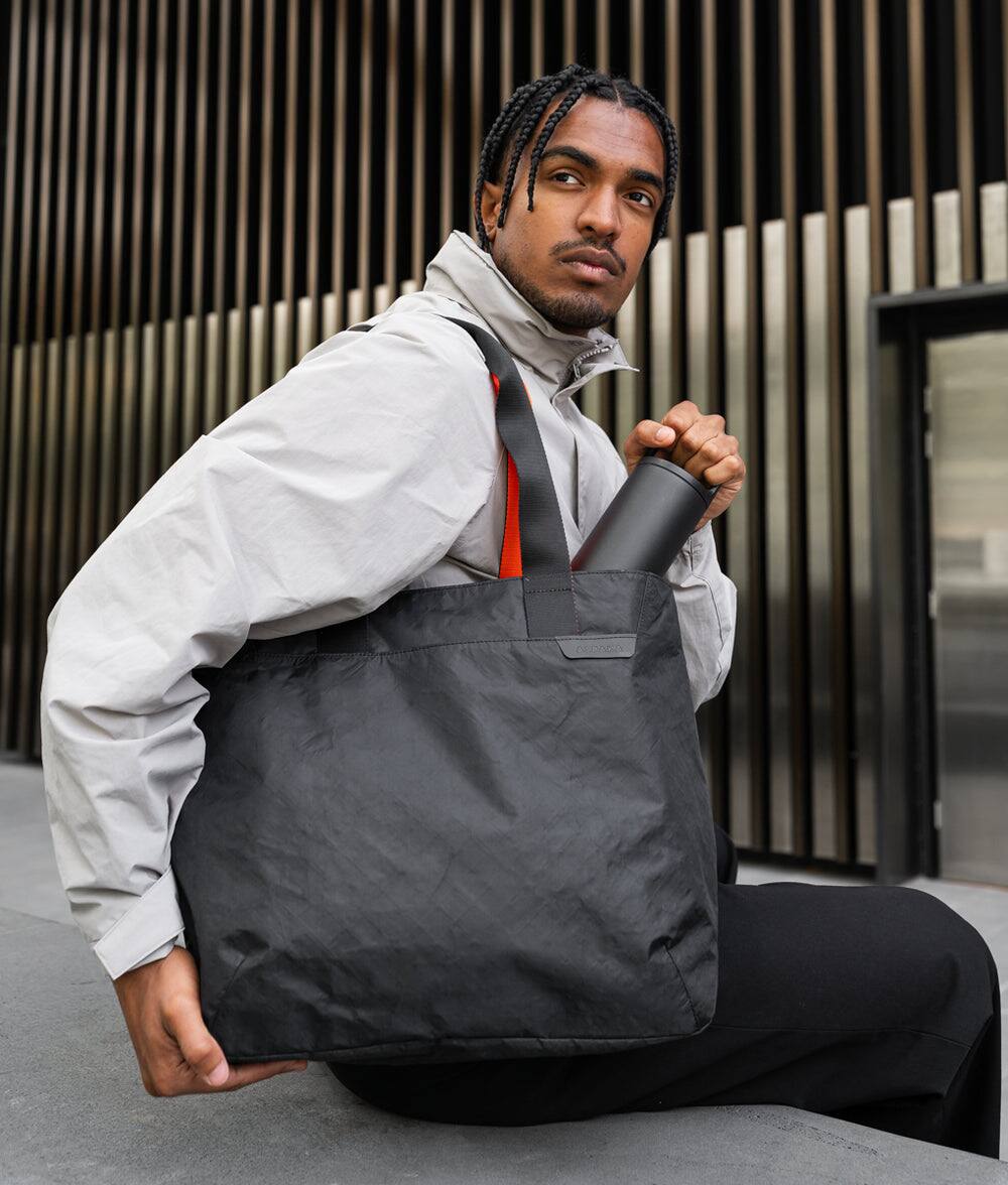 Alt View 7. ALPAKA - Elements Tote Bag 14.5L Weatherproof Foldable Travel Tote with Magnetic Closure - Black Axoflux 210D.