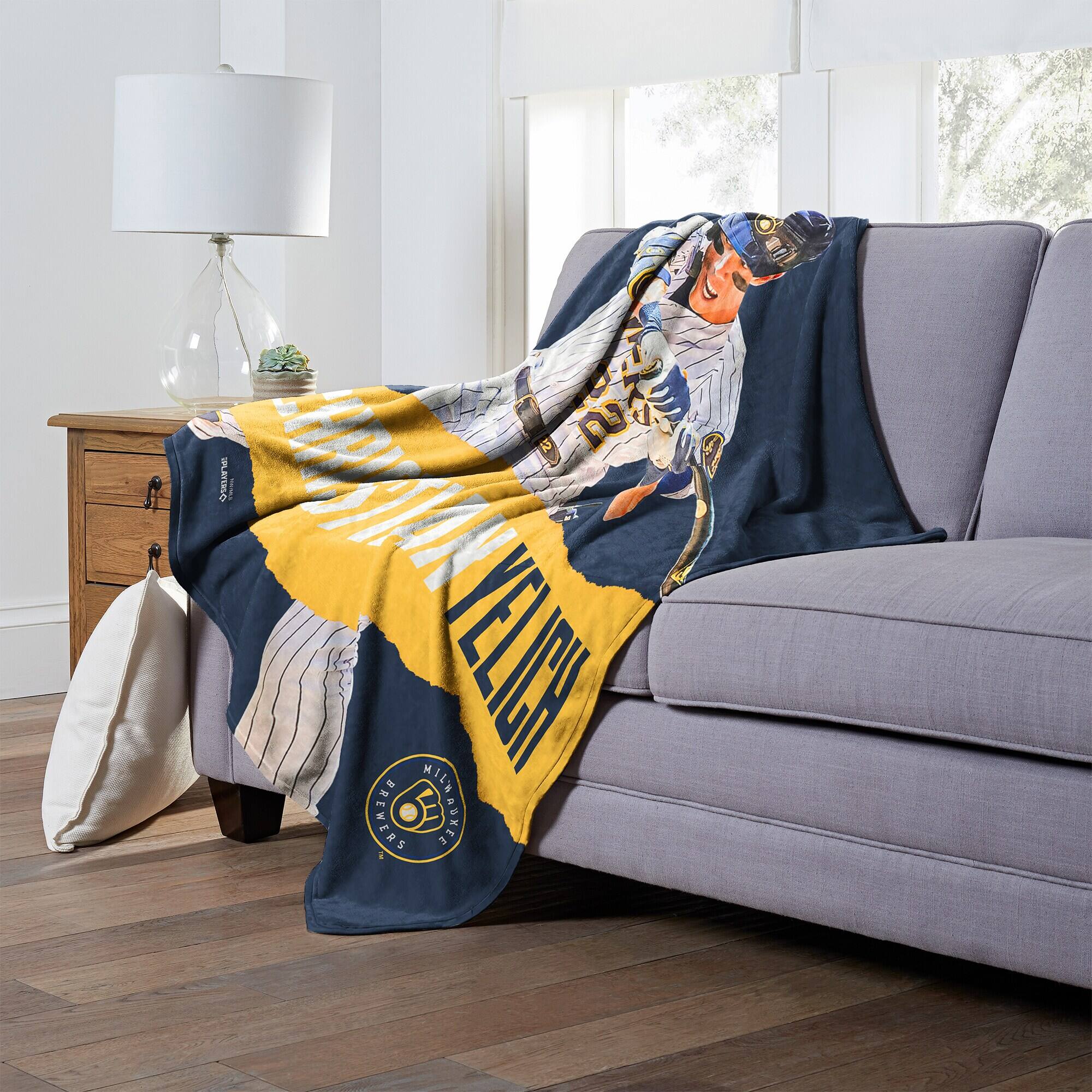 Sure, here is the corrected text:

- "MILWAUKEE BREWERS"
- "MILWAUKEE BREWERS" (on the blanket)
- "MILWAUKEE BREWERS" (on the blanket)
- "MILWAUKEE BREWERS" (on the blanket)