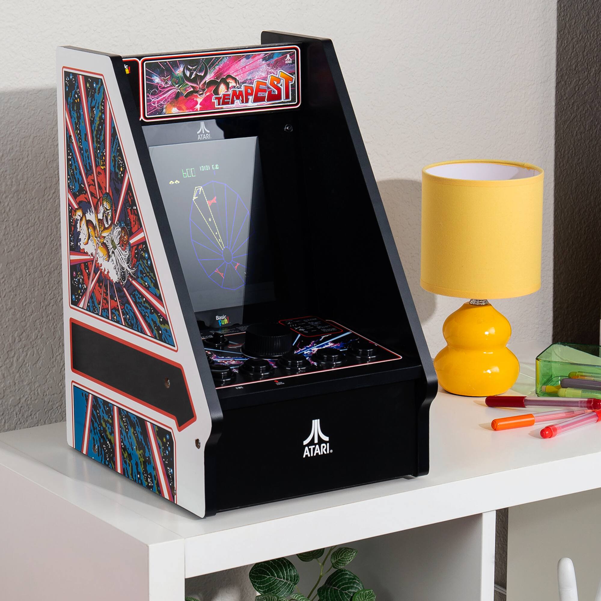 Sure, here is the corrected and grouped text from the image:

**Top of the Machine:**
- TEMPEST

**On the Screen:**
- 6.00
- 1000000

**On the Machine:**
- ATARI
- ATARI

**On the Joystick:**
- Basic Fun