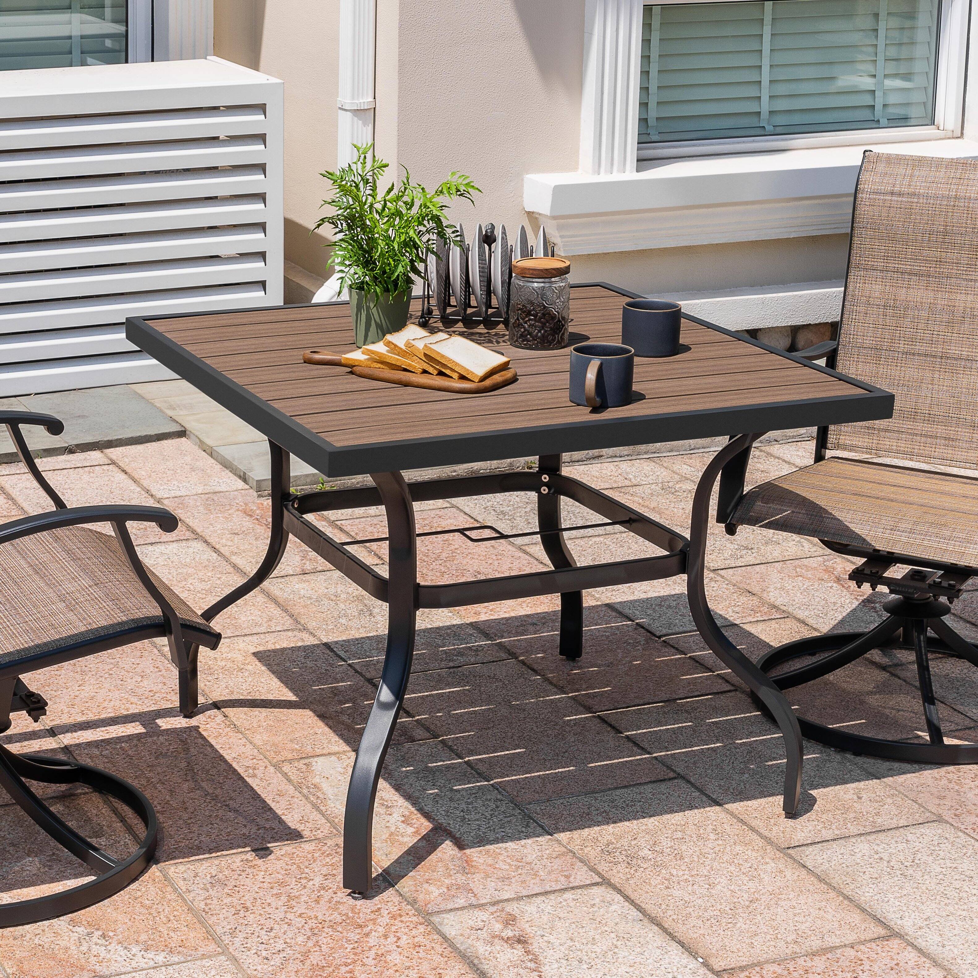 Angle. Nuu Garden - Outdoor 37" Square Metal Dining Table with 1.6'' Umbrella Hole, Powder-Coated Frame, Faux Wood Tabletop - Black and wood-grain finish.