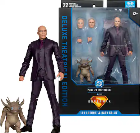 The image features a figure of Superman and a figure of Lex Luthor, both from the DC Multiverse edition. The figures are displayed next to each other, with the Superman figure standing tall and the Lex Luthor figure positioned slightly lower. The figures are part of a collectible set, and they are presented in a box.