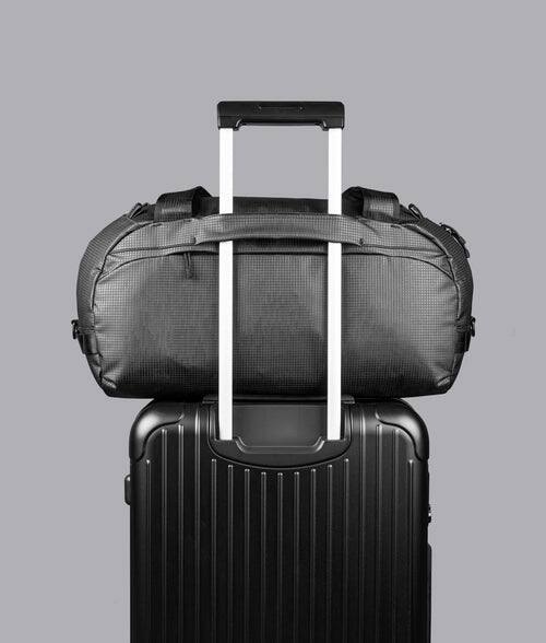 Back. ALPAKA - 35L Lightweight Duffel Bag for Gym, Weekend Trips & Carry-On Travel, Momentum Duffel, Weather-Resistant - Axodyne hybrid Black.