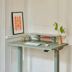 Front. Branch Furniture - Branch Small Monitor Stand – Sturdy Steel Stand with Elegant Felt Liner, Hidden Storage, and Universal Clamp - Sage.
