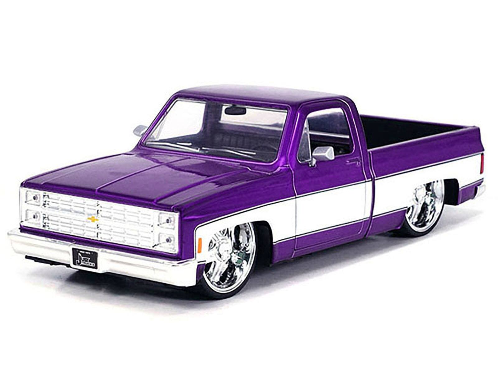 Angle. Jada - 1985 Chevrolet C-10 Pickup Truck Purple Metallic and White with Lorenzo Wheels "Just Trucks" Series 1/24 - Purple Metallic And White.