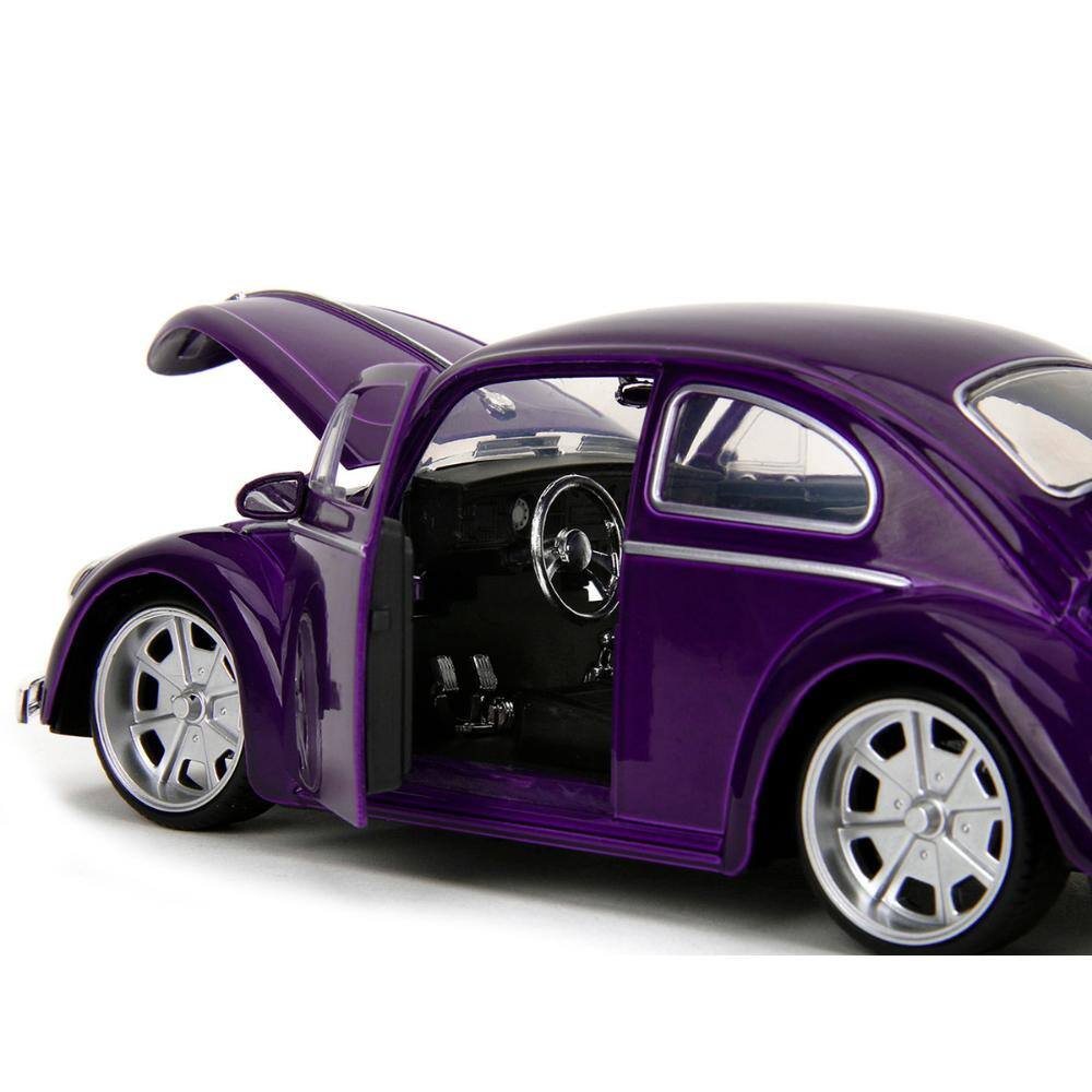 Left. Jada - Volkswagen Beetle Purple Metallic w/ Wednesday Addams Figure – Wednesday (2022) Hollywood Rides 1/24 - Purple Metallic.