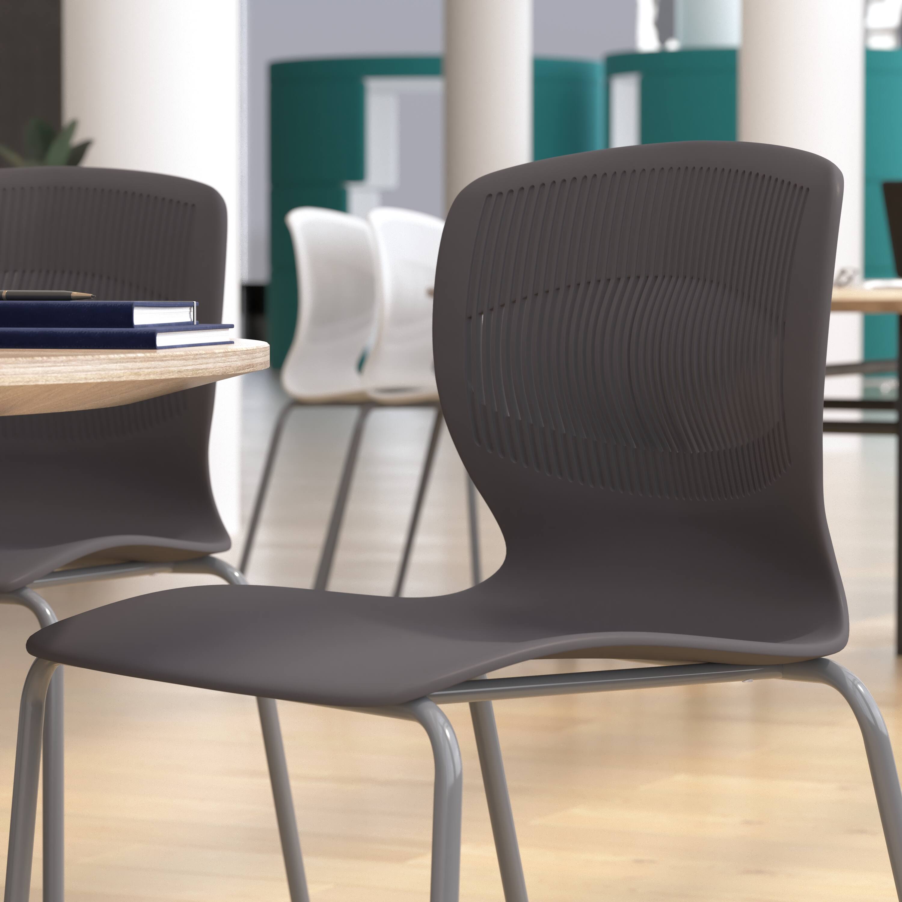 Alt View 5. Emma + Oliver - Heavy Duty 770 lb. Capacity Plastic Stack Chair with Steel Sled Base - Gray.