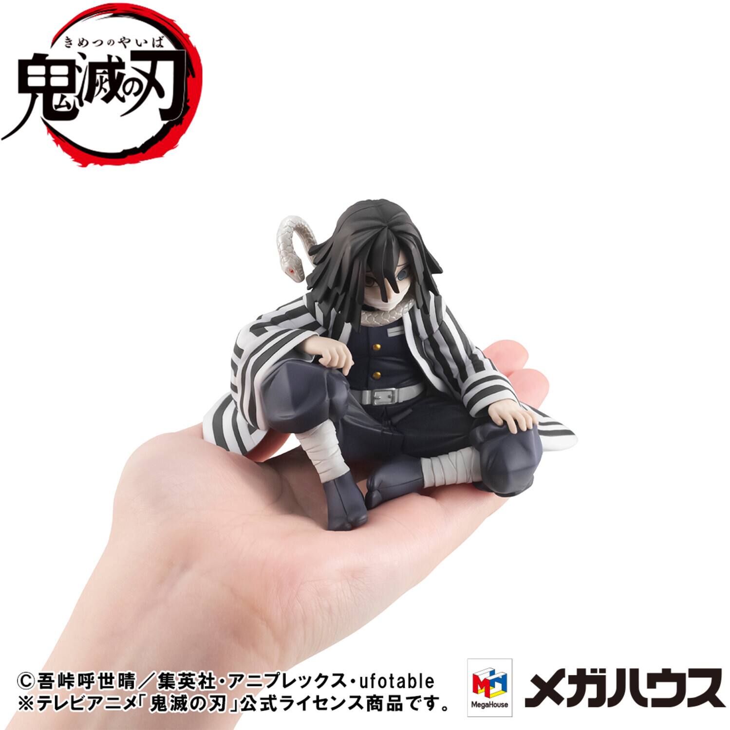 Certainly! Here is the corrected and grouped text from the image:

---

**Top Left:**
- 鬼滅の刃
- きめつのやいば

**Bottom Left:**
- ©吾峠呼世晴／集英社・アニプレックス・ufotable
- ※テレビアニメ「鬼滅の刃」公式ライセンス商品です。

**Bottom Right:**
- ufotable
- MegaHouse
- メガハウス

---