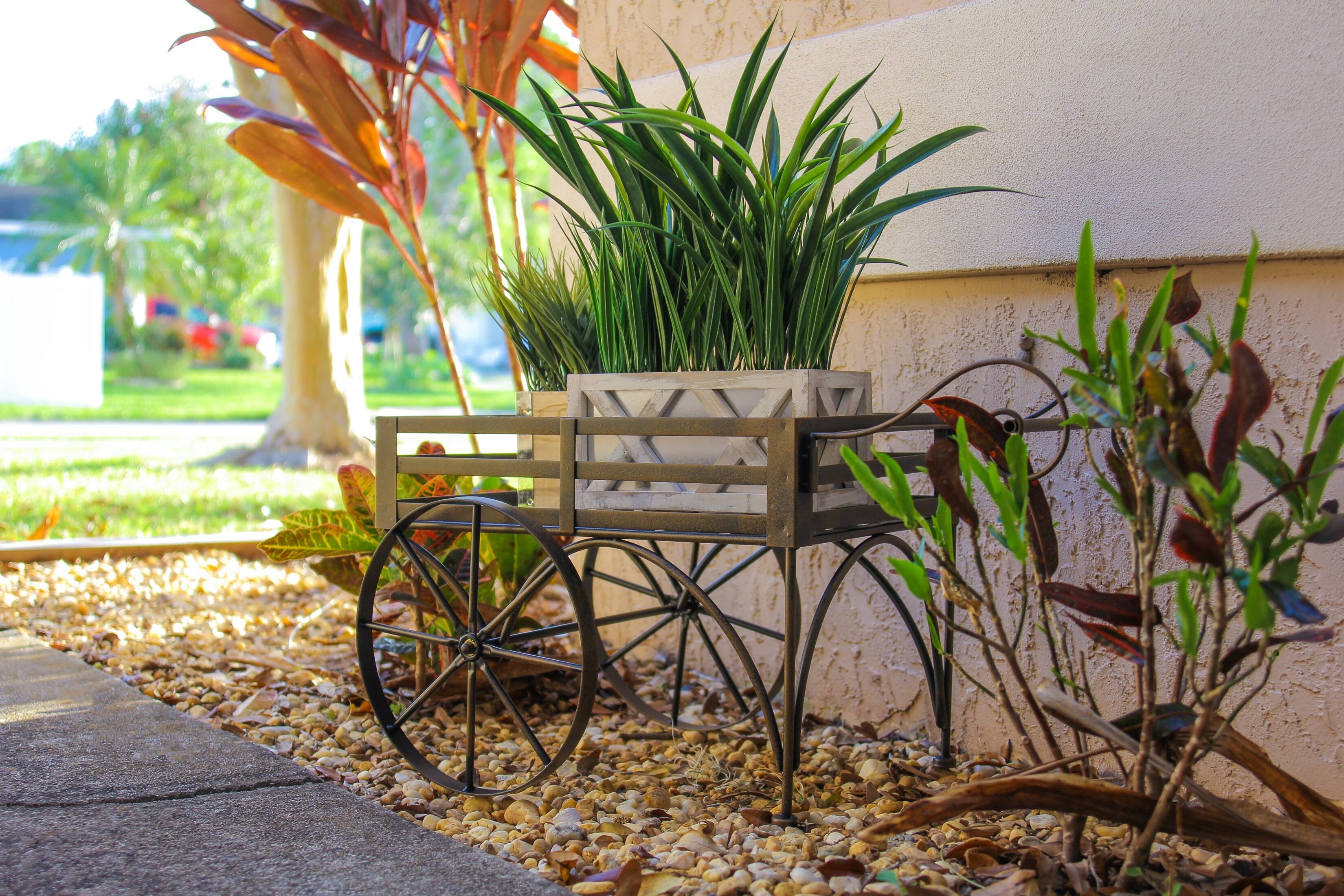 Alt View 3. Zeckos - 26 Inch Rustic Metal Wagon Cart Plant Stand Flower Holder Patio Art Garden Decor - Brown.