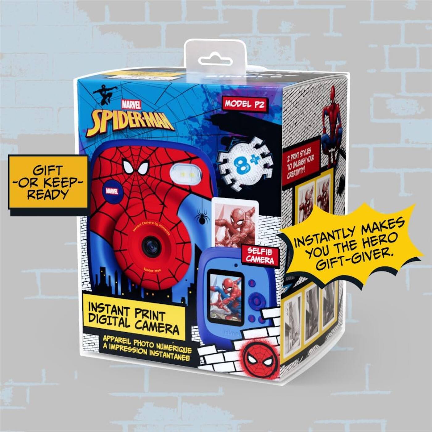Sure, here is the corrected and grouped text from the image:

---

**MARVEL SPIDER-MAN**

**GIFT - OR KEEP - READY**

**MODEL P2**

**INSTANT PRINT DIGITAL CAMERA**

**APPAREIL PHOTO NUMÉRIQUE A IMPRESSION INSTANTANÉE**

**SELFIE CAMERA**

**INSTANTLY MAKES YOU THE HERO GIFT-GIVER.**

**2 PRINT STICKERS TO UNLEASH YOUR CREATIVITY!**

**8+**

---

This text is organized to reflect the information and design elements on the packaging.