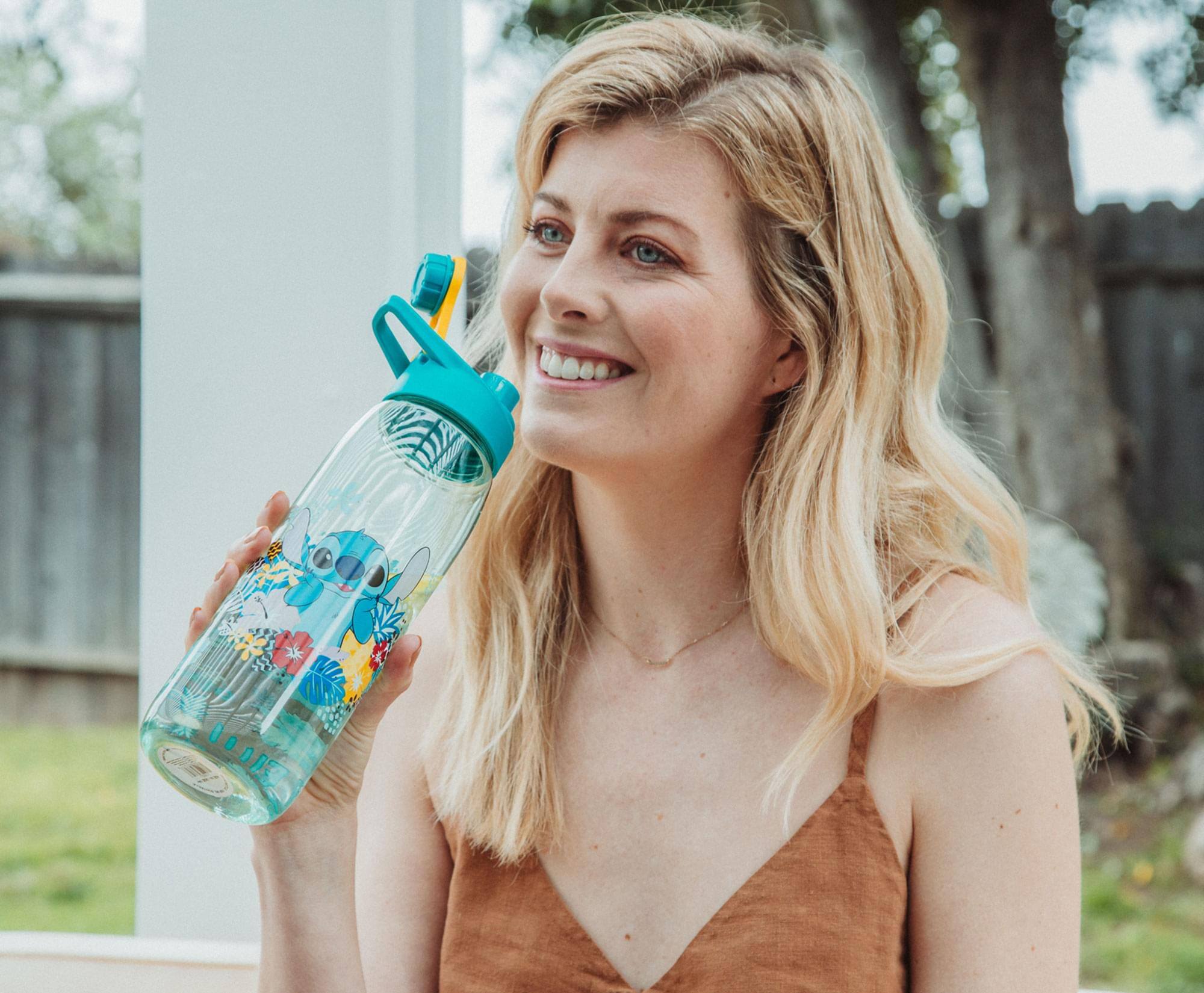 Alt View 2. Silver Buffalo - Disney Lilo & Stitch Tropical Water Bottle With Time Table | Holds 28 Ounces - Blue.