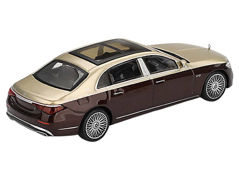 Left. Mini GT - Mercedes-Maybach S 680 Gold Metallic and Dark Red Metallic Limited Edition 1/64 Diecast Model Car by Mini GT - Gold Metallic and Dark Red Metallic.