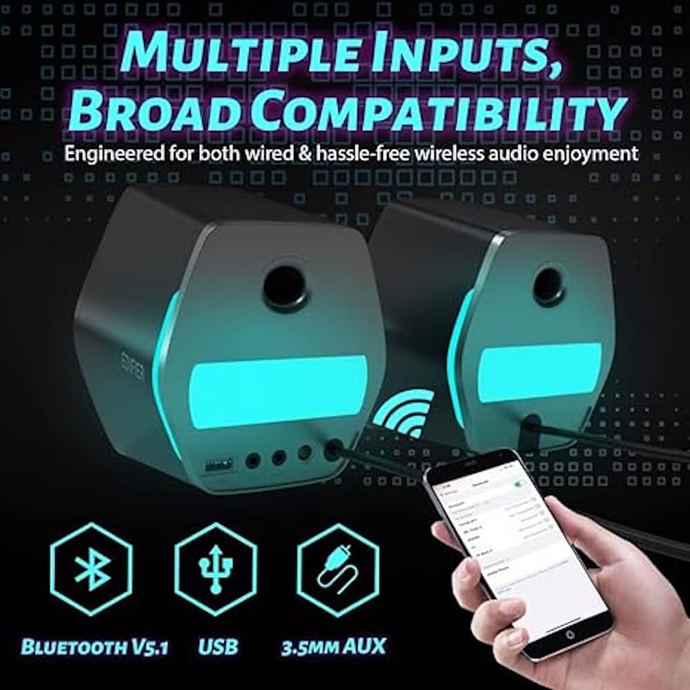 The image features a person holding a cell phone next to a device with multiple inputs, broad compatibility, and Bluetooth V5.1 USB 3.5MM AUX. The device is engineered for both wired and hassle-free wireless audio enjoyment.