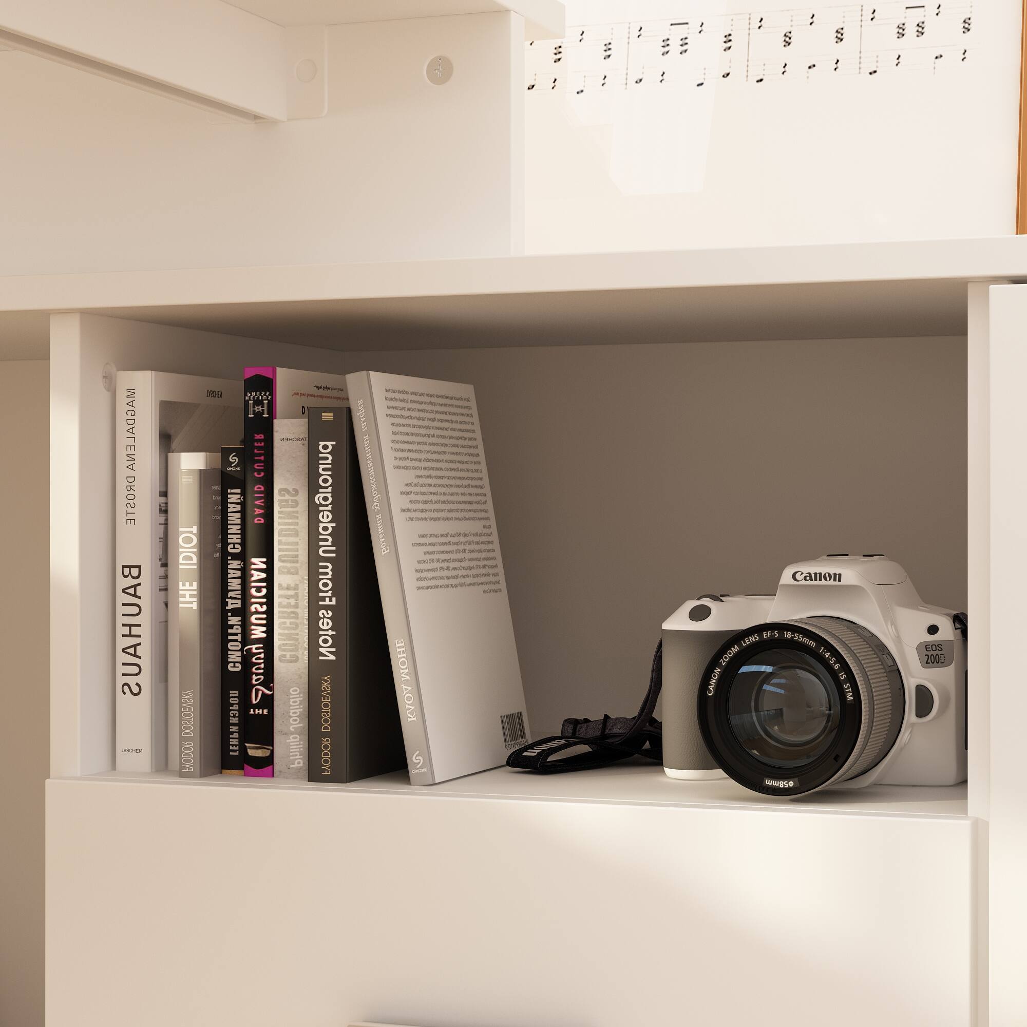 The text on the image is:

- MAGDALENA DROSTE BAUHAUS - 1 - s00 Mv - I"I - HC CUTLER IDIOT ! DAVID BUILDINGS Underground THE .V MUSICIAN From . CONCRETE Notes Savvy DOSTOEVSKY DBICEAZIA CH ..E oibibol LEBN Philip FRODOR  - sad - -- - - - - - - d - - - i - - i - - OHE  Canon EF-S 18-55mm LENS 200M E a CANON STM wwgse KOS 200.