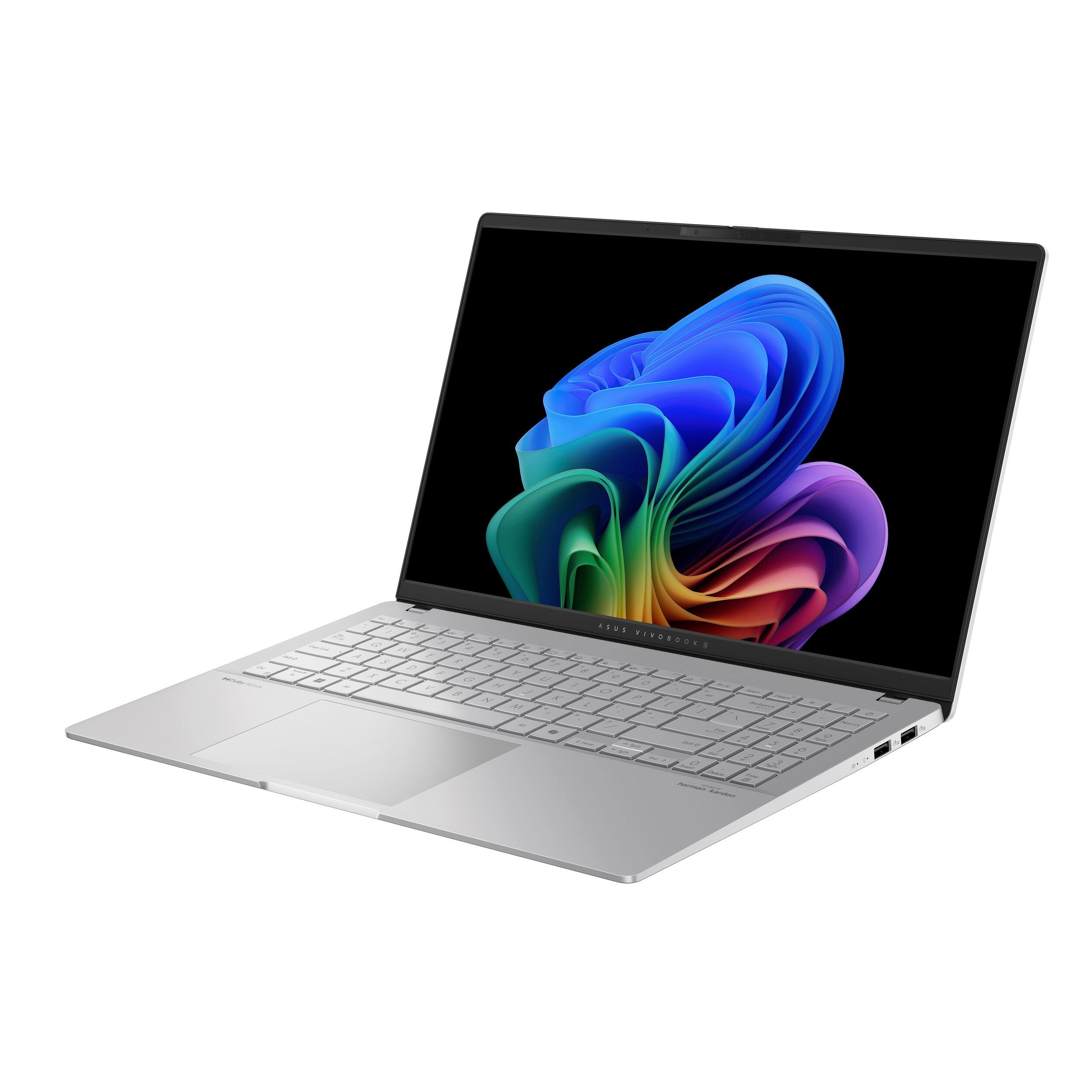 The image features a laptop computer with a colorful background on the screen. The laptop is open and ready for use. The screen is displaying a vibrant image, which adds to the overall visual appeal of the device. The laptop is likely to be a MacBook, given its sleek design and the Apple logo on the screen.