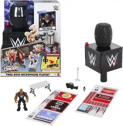 The text on the image can be grouped and corrected as follows:
- "INCLUDES THE ROCK"
- "THIS WAY DOWN TO ARENA TRANSFORMS KNUCKLE CRUNCHERS 2 WAYS TO PLAY!"
- "FINAL BOSS MICROPHONE PLAYSET"
- "2 WAYS TO PLAY!"
- "FINAL BOSS MICROPHONE PLAYSET"
- "6+"
- "WWE"
- "THE ROCK"
- "WWE KNUCKLE CRUNCHERS"
- "TRANSFORMS"
- "2 WAYS TO PLAY!"
- "FINAL BOSS MICROPHONE PLAYSET"
- "6+"
- "WWE"
- "THE ROCK"
- "WWE KNUCKLE CRUNCHERS"
- "TRANSFORMS"
- "2 WAYS TO PLAY!"
- "FINAL BOSS MICROPHONE PLAYSET"
- "6+"
- "WWE"
- "THE ROCK"
- "WWE KNUCKLE CRUNCHERS"
- "TRANSFORMS"
- "2 WAYS TO PLAY!"
- "FINAL BOSS MICROPHONE PLAYSET"
- "6+"
- "WWE"
- "THE ROCK"
- "WWE KNUCKLE CRUNCHERS"
- "TRANSFORMS"
- "2 WAYS TO PLAY!"
- "FINAL BOSS MICROPHONE PLAYSET"
- "6+"
- "WWE"
- "THE ROCK"
- "WWE KNUCKLE CRUNCHERS"
- "TRANSFORMS"
- "2 WAYS TO PLAY!"
- "FINAL BOSS MICROPHONE PLAYSET"
- "6+"
- "WWE"
- "THE ROCK"
- "WWE KNUCKLE CRUNCHERS"
- "TRANSFORMS"
- "2 WAYS TO PLAY!"
- "FINAL BOSS MICROPHONE PLAYSET"
- "6+"
- "WWE"
- "THE ROCK"
- "WWE KNUCKLE CRUNCHERS"
- "TRANSFORMS"
- "2 WAYS TO PLAY!"
- "FINAL BOSS MICROPHONE PLAYSET"
- "6+"
- "WWE"
- "THE ROCK"
- "WWE KNUCKLE CRUNCHERS"
- "TRANSFORMS"
- "2 WAYS TO PLAY!"
- "FINAL BOSS MICROPHONE PLAYSET"
- "6+"
- "WWE"
- "THE ROCK"
- "WWE KNUCKLE CRUNCHERS"
- "TRANSFORM