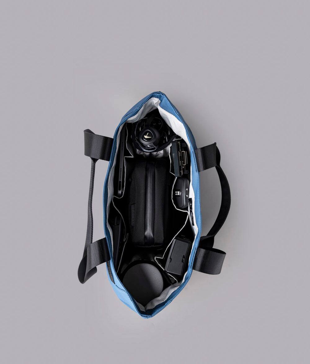 Alt View 4. ALPAKA - Elements Tote Bag 14.5L Weatherproof Foldable Travel Tote with Magnetic Closure - Blue/G Axoflux 210D.