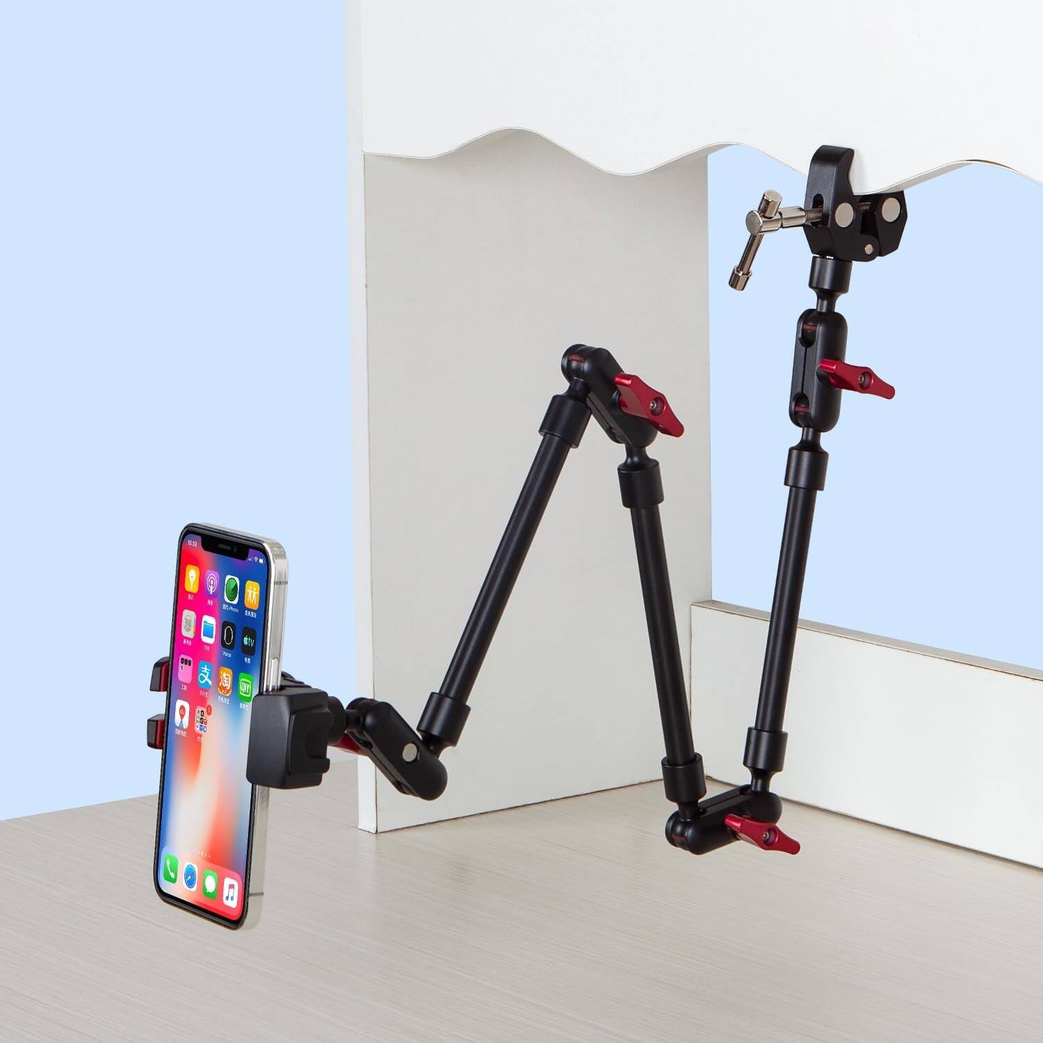 Left. PARKER SLATER - Adjustable articulating magic arm with clamp and phone holder clip for desk mount, stand, or tripod use. - Black.