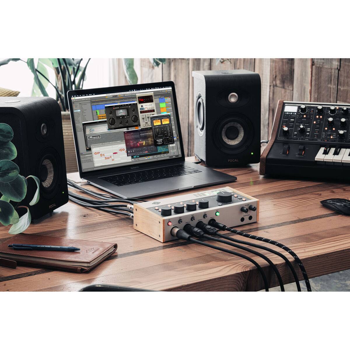 The text in the image reads:

- "FOCAL" (on the speaker)
- "FOCAL" (on the laptop screen)
- "Ableton Live" (on the laptop screen)