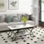 I cannot group or correct the text as it does not seem to be related to the image. The image shows a living room with a couch, coffee table, and a vase of flowers.