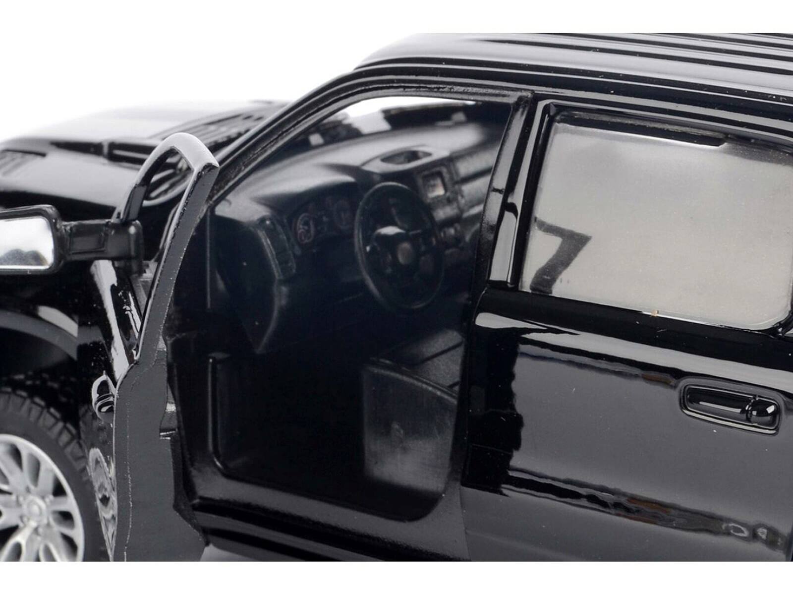 Alt View 2. Motormax - 2019 RAM 1500 Laramie Crew Cab Pickup Truck Black with Silver Stripes 1/24 Diecast Model Car by Motormax.