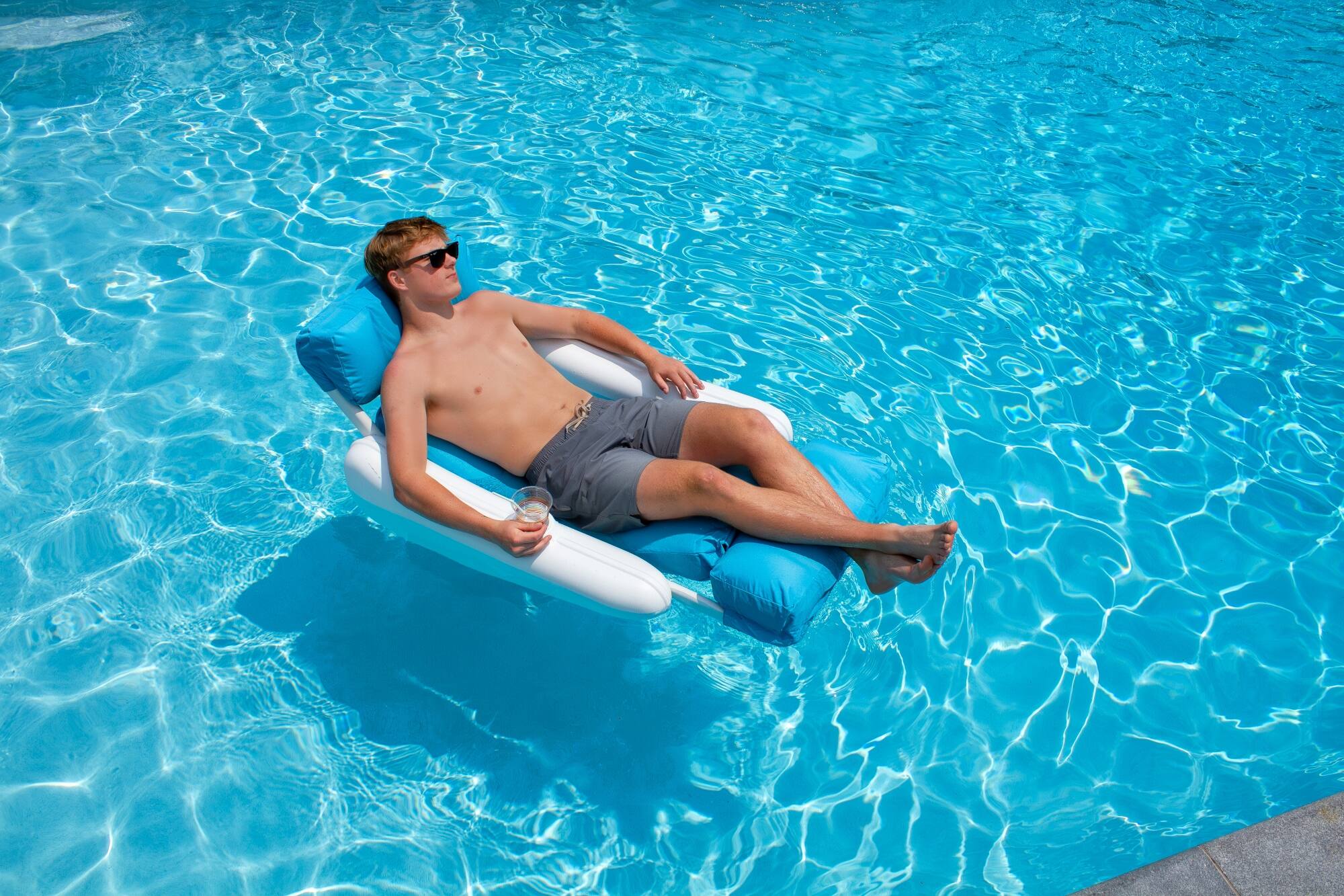 Alt View 3. Swim Central - Inflatable Swimming Pool Floating Lounge Seat - 66" - Blue and White - Blue.