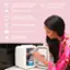 The image features a woman opening a small refrigerator, which is designed to store and preserve various products. The refrigerator is equipped with a mirrored door that has four LED modes, providing different lighting options for the user. The refrigerator also has two removable shelves, allowing for additional storage space. The refrigerator is designed to optimize and prolong the shelf life of the user's skincare products, making it a convenient and practical choice for storing and preserving these items. The woman is opening the refrigerator, likely to retrieve one of the stored products.