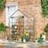 Alt View 1. Outsunny - 5' x 2.5' x 6.5' Mini Walk-in Greenhouse Kit, Portable Green House with 3 Tier Shelves, Roll-Up Door.