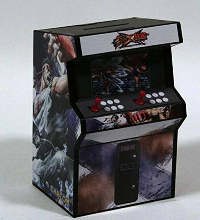 Left. Capcom - Street Fighter x Tekken Coin Bank Special Edition.