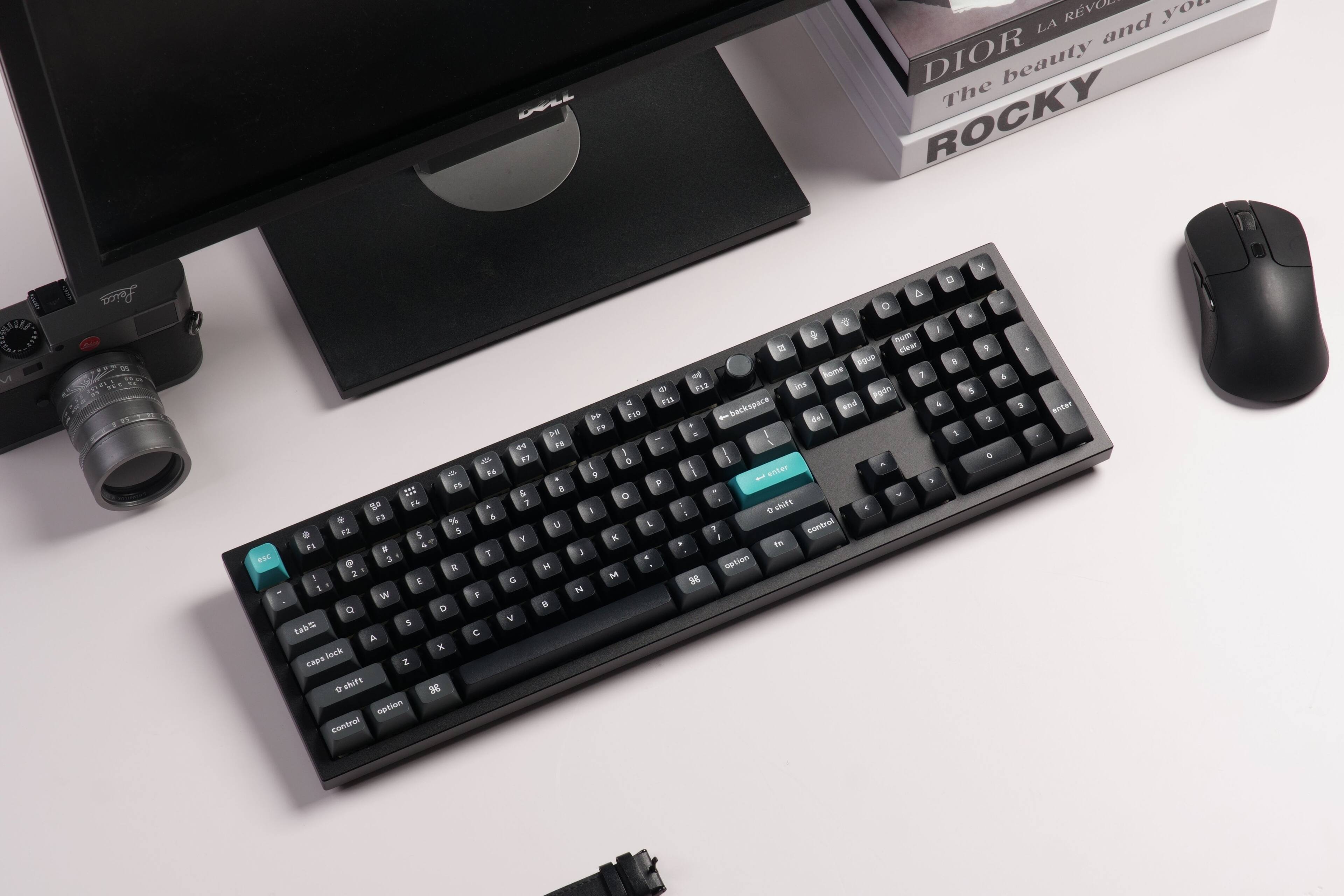 Sure, here is the corrected and grouped text from the image:

---

**DIOR LA REVOLUTION**  
The beauty and you  
**ROCKY**

---

**Leica**  
**i**  
**1 eSC - P5 10 o 14 . 3 % . F2 5 5 FS . 4 P 3 R 1 2 - E 1 W Q D 5 tab A x Sock CHOS Z D shift 3 setion contral**  
**- & T F C 40 F7 & 7 Y D V 2 F i u B A D hum clear Pque o htme 7 D F12 is Pgin a FIE backspace and 1 F59 del FF . - I I I a - i enter 9 I au , - O I - shift E . L Control 1 - - In I - setion M 28 D - 8 4 1 5 3 e & 5 entT**

---

**Keyboard Layout:**

- **Top Row:** 1 2 3 4 5 6 7 8 9 0 - = Backspace
- **Second Row:**