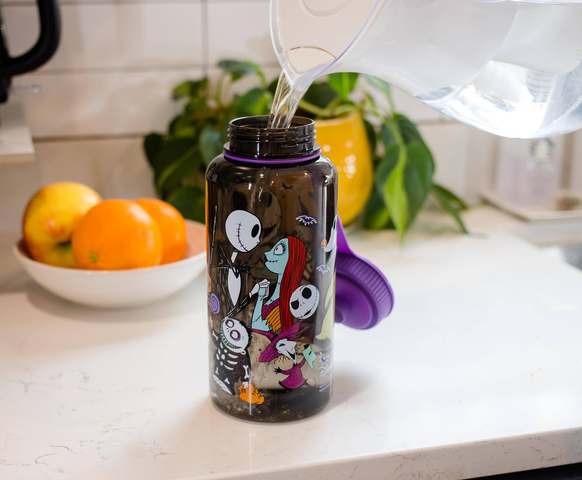 Alt View 2. Disney - The Nightmare Before Christmas Plastic Water Bottle | Holds 34 Ounces - Purple.