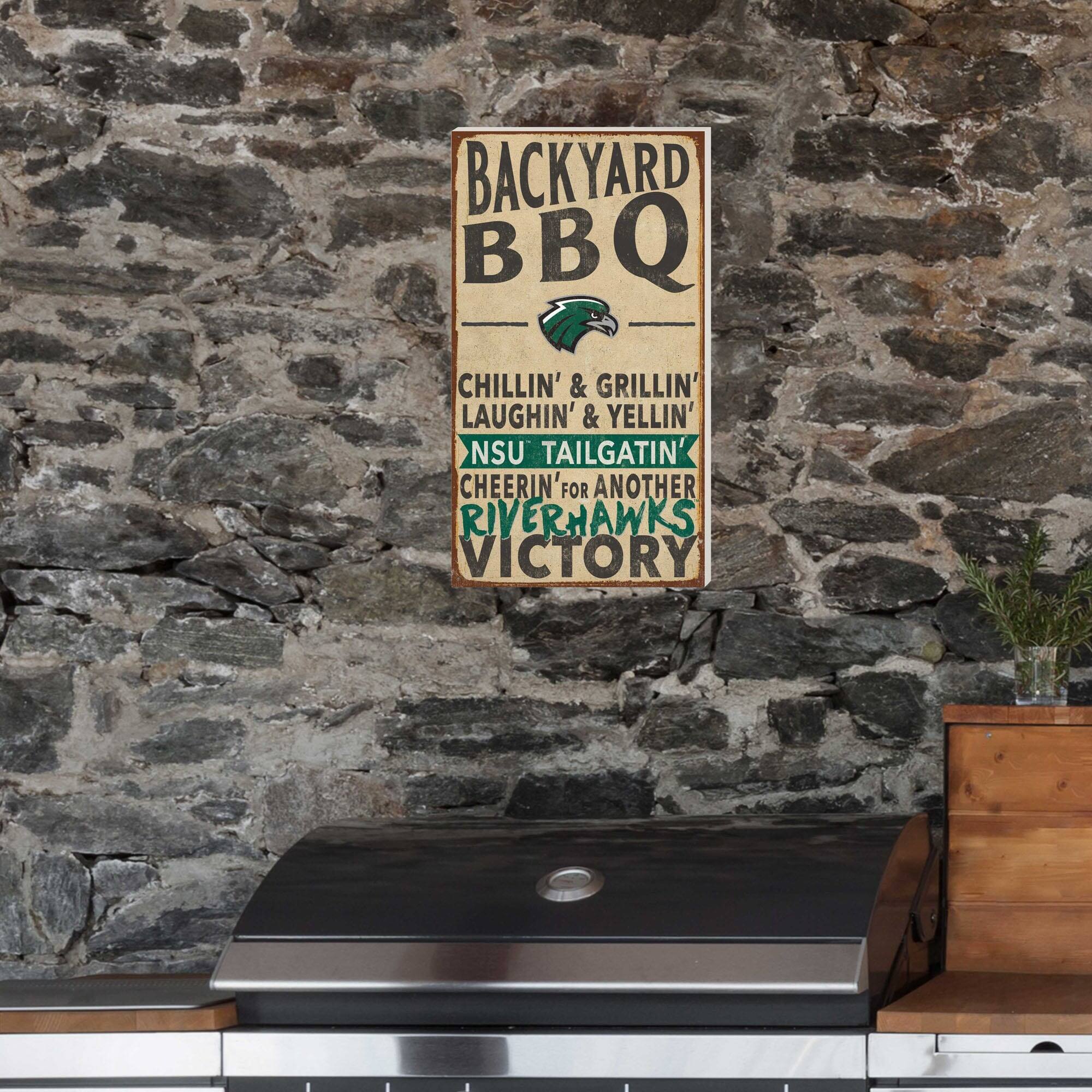 BACKYARD BBQ  
CHILLIN' & GRILLIN'  
LAUGHIN' & YELLIN'  
NSU TAILGATIN'  
CHEERIN' FOR ANOTHER RIVERHAWKS VICTORY