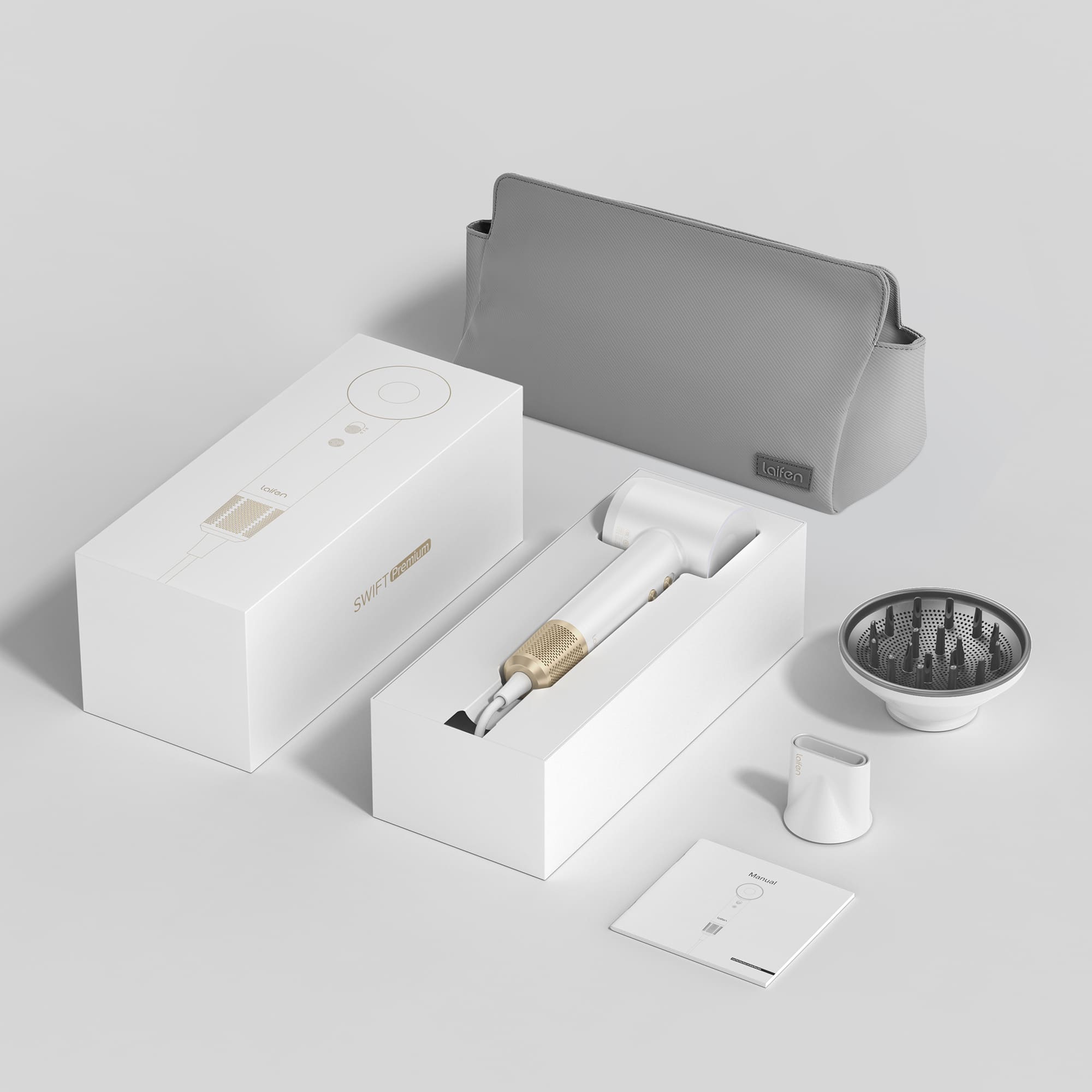 The image shows a white box with a hair dryer and a brush inside. The hair dryer is placed next to the box, and the brush is located to the right of the box. The box also contains a small bag, which is placed on the right side of the box. The overall scene suggests that the hair dryer and brush are new and ready to be used.