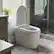 Angle. Famapy - Touchless Smart Toilet with Auto Lid & Auto Flush, Adjustable Bidet Wash, Heated Seat, Warm-Air Dryer, Emergency Flush - White.