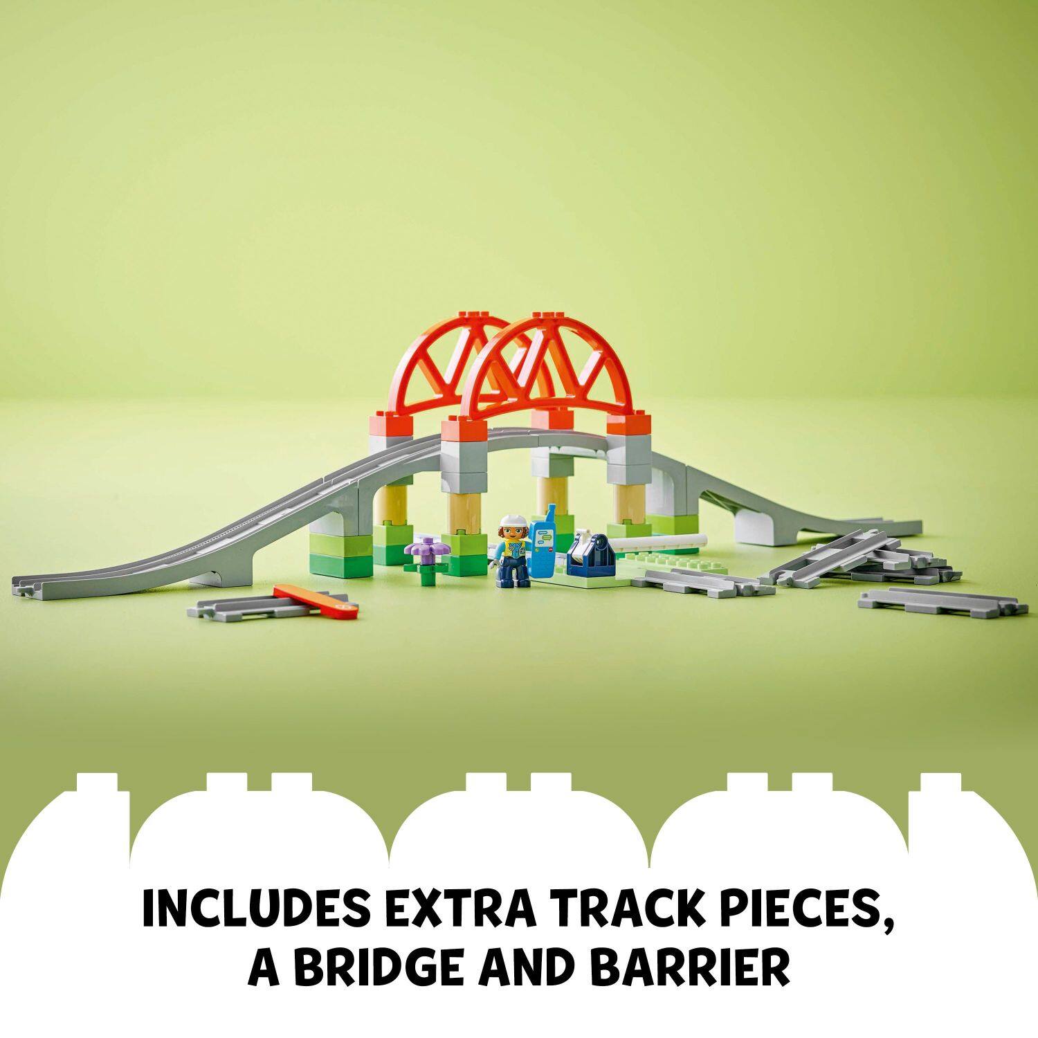 The text on the image reads, "Includes extra track pieces, a bridge and barrier."