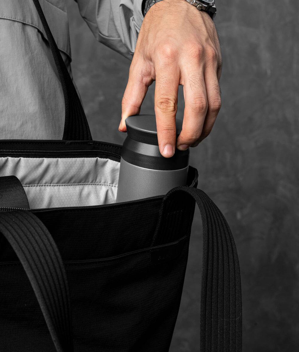 Alt View 2. ALPAKA - Flight Tote (L) Laptop Tote Bag for Work, Large Tote Bag Fits 16" MacBook Pro, Water Bottle Pocket, Luggage Pass-Through - Black Axoflux 400D.