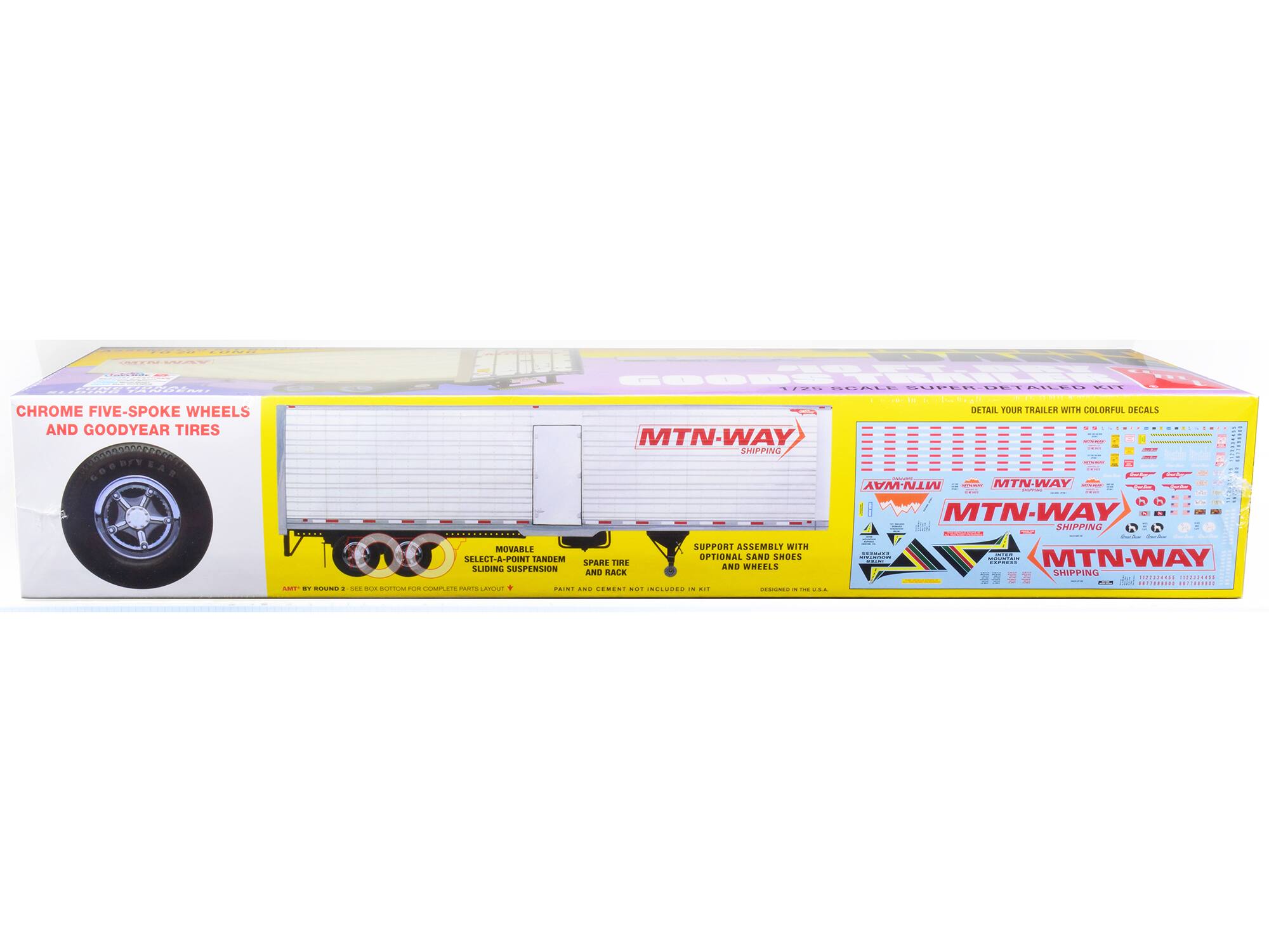 Sure, here is the corrected and grouped text from the image:

---

**MTN-WAY SHIPPING**

**CHROME FIVE-SPOKE WHEELS AND GOODYEAR TIRES**

- **DETAIL YOUR TRAILER WITH COLORFUL DECALS**
- **MOVABLE SELECT-A-POINT TANDEM SLIDING SUSPENSION**
- **SPARE TIRE AND RACK**
- **SUPPORT ASSEMBLY WITH OPTIONAL SAND SHOES AND WHEELS**
- **COMPLETE PARTS LAYOUT**
- **PAINT AND CEMENT NOT INCLUDED IN KIT**
- **DESIGNED IN THE U.S.A.**

**ASSEMBLY BY ROUND 2 SEE BOX BOTTOM FOR**

---

This text is organized to reflect the information on the packaging of the MTN-WAY trailer model.