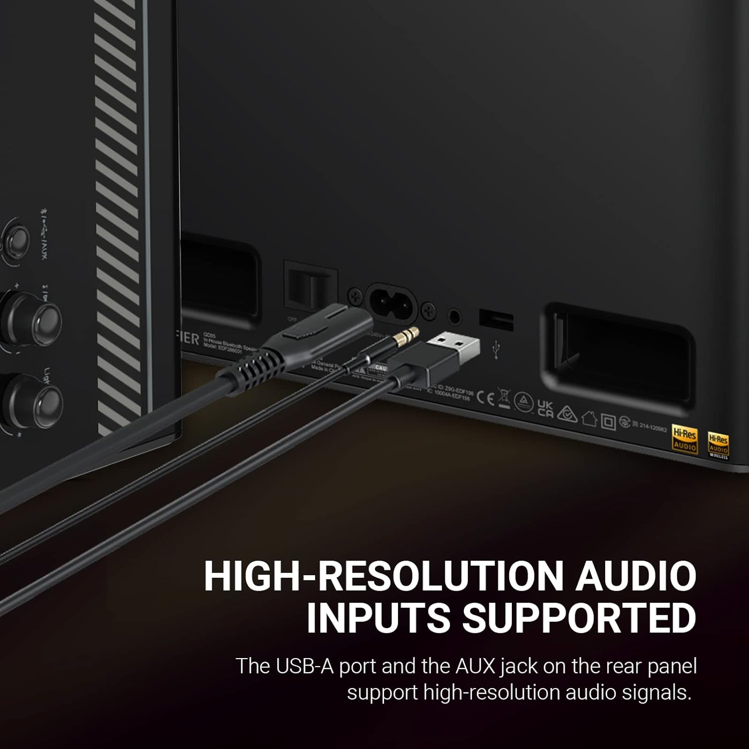 The image features a black speaker with a USB-A port and an AUX jack on the rear panel. The speaker supports high-resolution audio inputs, as indicated by the USB-A port and AUX jack. The speaker is designed to provide high-quality audio output, making it an ideal choice for audiophiles and music enthusiasts.