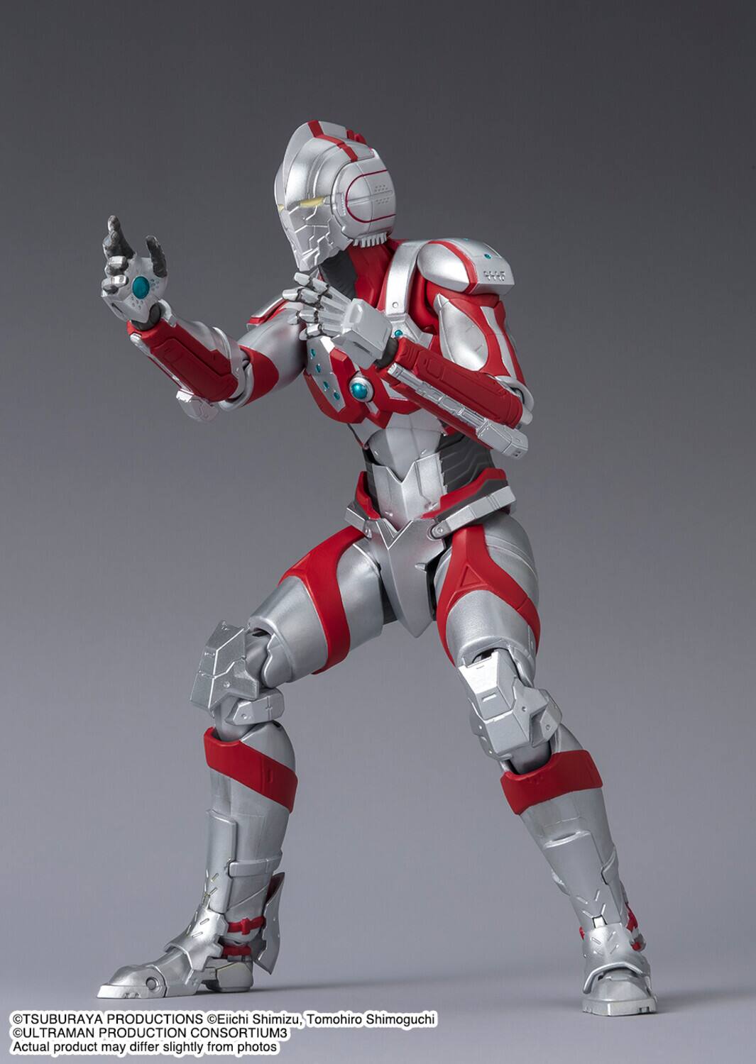 The text on the image is:

"TSUBURAYA PRODUCTIONS Eiichi Shimizu, Tomohiro Shimoguchi ULTRAMAN PRODUCTION CONSORTIUM
Actual product may differ slightly from photos

©TSUBURAYA PRODUCTIONS ©Eiichi Shimizu, Tomohiro Shimoguchi
ULTRAMAN PRODUCTION CONSORTIUM All rights reserved."