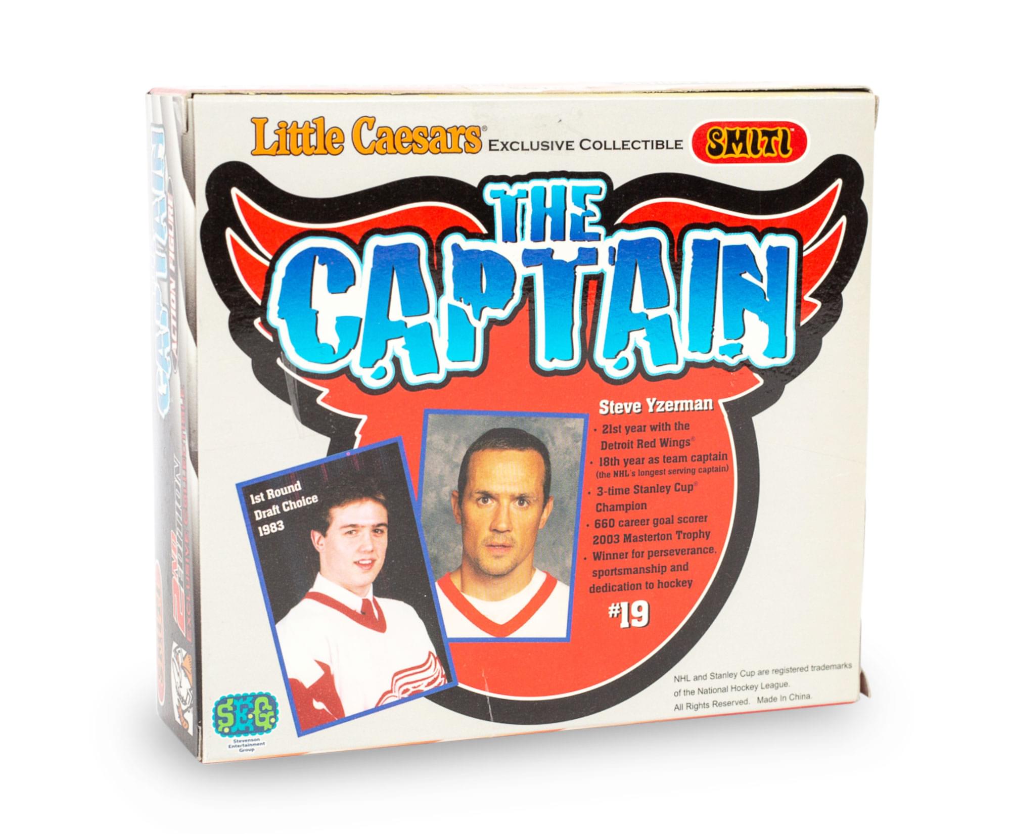 Little Caesars Exclusive Collectible  
SMITI  
THE CAPTAIN  
Steve Yzerman  

1st Round Draft Choice 1983  

- 21st year with the Detroit Red Wings  
- 18th year as team captain (NHL's longest serving captain)  
- 3-time Stanley Cup Champion  
- 660 career goal scorer  
- 2003 Masterton Trophy Winner for perseverance, sportsmanship and dedication to hockey  

#19  

NHL and Stanley Cup are registered trademarks of the National Hockey League. All Rights Reserved. Made in China.
