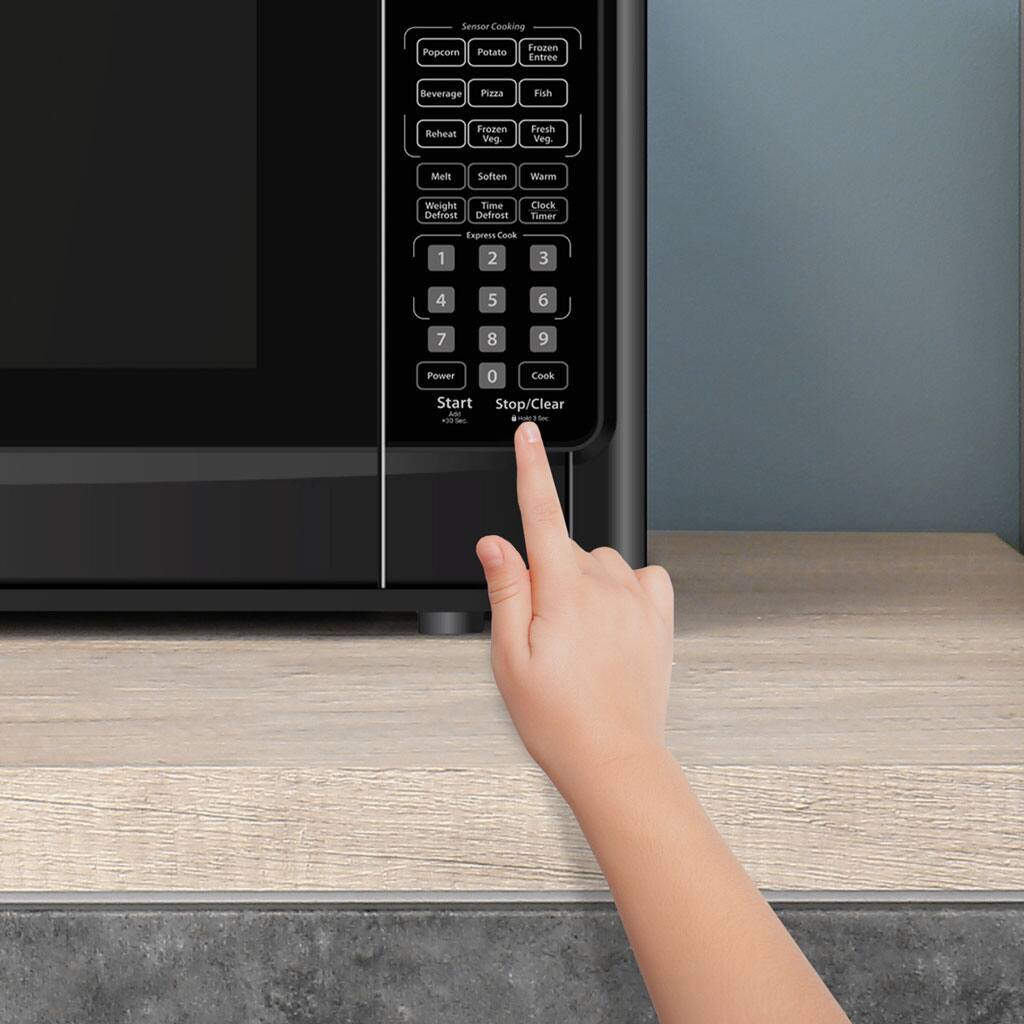 Seser Cooking Pepcom Potato Frozen Entree Beverage Pizza Fish Reheal Frozen Vies Fresh Vieg Mell Sotien Wann Weight Time Defrost Defrest Clock Timer Express Conk 1 2 3 4 5 6 7 8 9 Power 0 Cook Start Stop/Clear -N a50 -e .