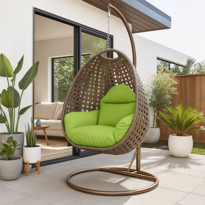 Angle. LeisureMod - LeisureMod Beige Wicker Hanging Egg Chair with Iron Stand & Cushion - All-Weather Single Outdoor Patio Swing - Light Green.