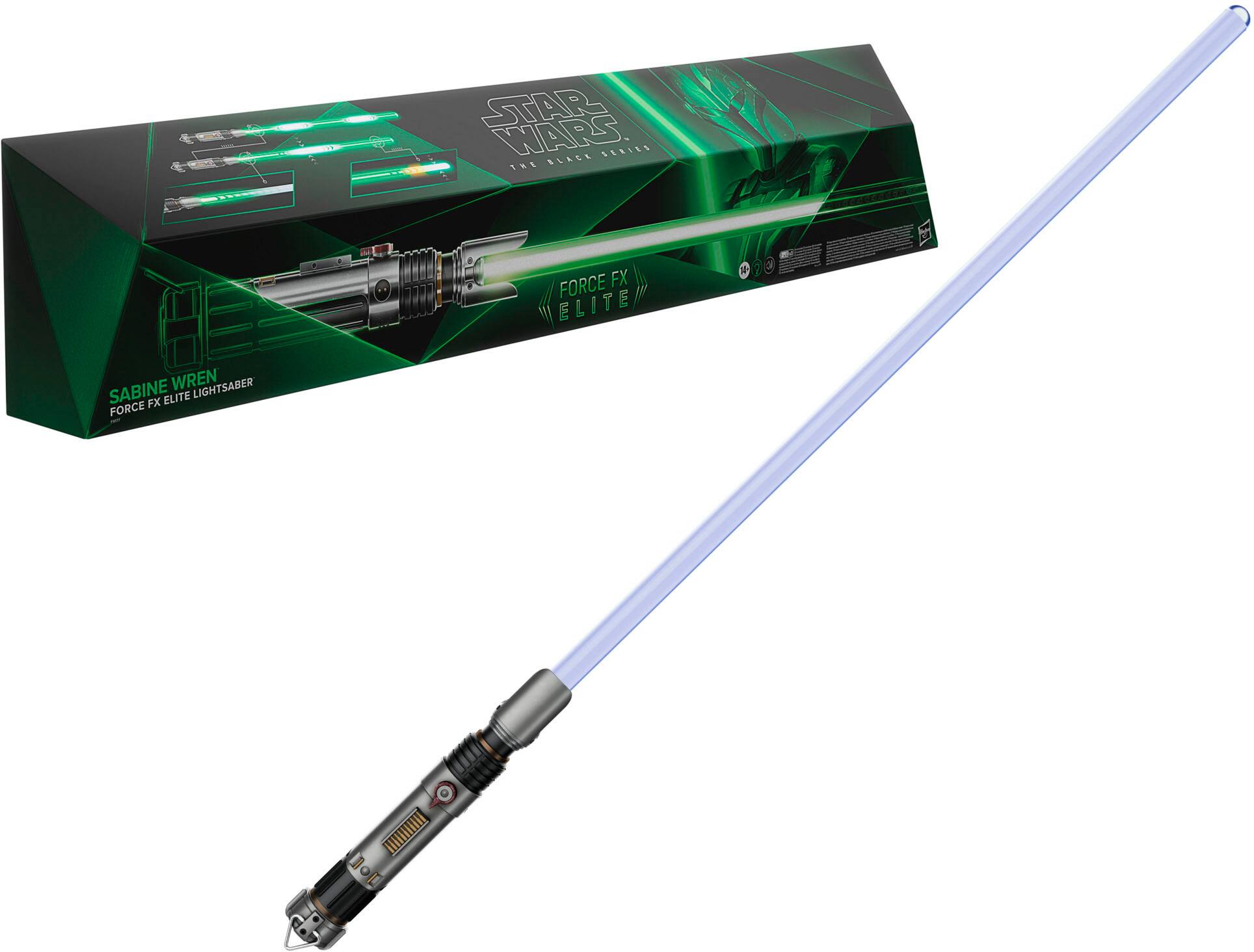 The image features a Star Wars lightsaber, specifically the Force FX Elite Sabine Wren Lightsaber. The lightsaber is displayed in a box, and it is made of a green and yellow color. The lightsaber is placed next to the box, showcasing its design and size.